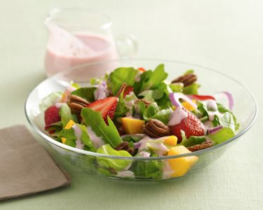 A strawberry summer salad with a strawberry yogurt dressing
