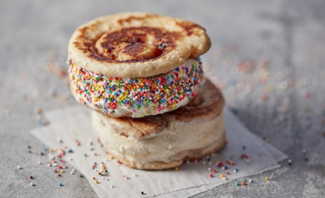 Dulce de Leche ice cream rolled in rainbow sprinkles sandwiched between two Pillsbury™ cinnamon rolls.