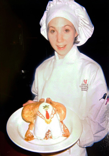 Chef Jessie during her time at The Art Institutes International Minnesota holding a finished plate.