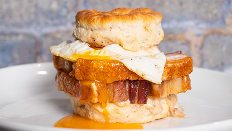 Biscuit breakfast sandwich with egg and bacon