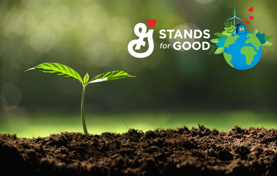 Small green sprout growing from soil with “G Stands For Good” white text overlay and globe 