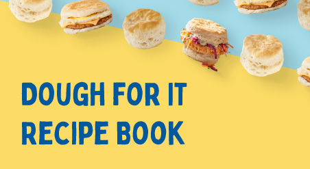 Dough for It Recipe Book. Biscuits, Sausage, Egg & Cheese Biscuit Sandwiches, and Fried Chicken Biscuit Sandwiches with Coleslaw lined up in a diagonal line on a yellow and light blue background.