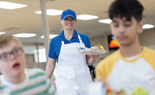 K12 Operator serving students lunch