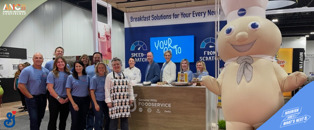 The General Mills team at the ANC 2023 booth with the Pillsbury Doughboy