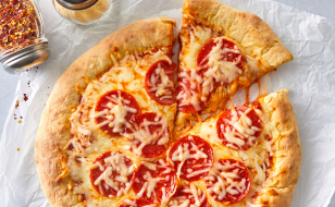 A pizza with cheese and pepperoni on it.