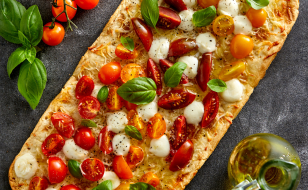 Flatbread Margherita pizza with tomato, cheese and basil.