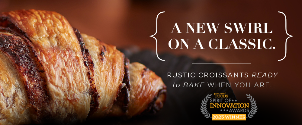Image of a freshly baked chocolate swirl croissant. A new swirl on a classic. Rustic croissants ready to bake when you are.